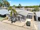 Beautiful home with a metal roof, extra garage, and a golf cart in the driveway at 17 Braden Castle Dr, Bradenton, FL 34208
