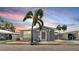 Charming single-story home with a well-manicured lawn and cozy outdoor seating area at 17 Braden Castle Dr, Bradenton, FL 34208