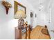 Bright hallway with hardwood floors and decor, perfect for a welcoming entrance at 17 Braden Castle Dr, Bradenton, FL 34208