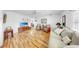Hardwood floors add beauty to this well-lit living room with neutral colored walls at 17 Braden Castle Dr, Bradenton, FL 34208