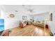 Bright living room with neutral colored walls, hardwood floors, and cozy furnishings at 17 Braden Castle Dr, Bradenton, FL 34208