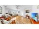 Bright living room features hardwood floors, ceiling fan, and cozy furnishings at 17 Braden Castle Dr, Bradenton, FL 34208