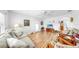 Bright living room features hardwood floors, ceiling fan, and plenty of natural light at 17 Braden Castle Dr, Bradenton, FL 34208