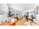 Bright sun room with hardwood floors, offering a tranquil space with ample natural light at 17 Braden Castle Dr, Bradenton, FL 34208