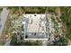 Top down view of cinder block home under construction, showing the home's layout in a wooded area at 17461 Dudley Ave, Port Charlotte, FL 33954