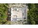 Aerial top shot of cinder block home under construction showing foundation and room divisions in wooded area at 17461 Dudley Ave, Port Charlotte, FL 33954