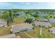 Aerial view showcasing the neighborhood with mature trees, well-maintained lawns, and charming homes at 1906 Canterbury Ln # 16, Sun City Center, FL 33573