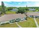 An aerial shot of a charming home, showcasing its well-manicured lawn, quaint exterior, and neighborhood at 1906 Canterbury Ln # 16, Sun City Center, FL 33573