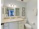 Bright bathroom featuring a granite countertop and a view to the shower at 1906 Canterbury Ln # 16, Sun City Center, FL 33573
