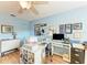 Bright bedroom with a ceiling fan, plenty of natural light, and ample workspace at 1906 Canterbury Ln # 16, Sun City Center, FL 33573
