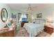 Calming bedroom with a ceiling fan, comfy bed, and soft blue tones to enhance relaxation at 1906 Canterbury Ln # 16, Sun City Center, FL 33573