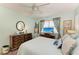 Serene bedroom with soft lighting, ceiling fan, and tranquil views at 1906 Canterbury Ln # 16, Sun City Center, FL 33573