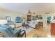 Inviting living room with hardwood floors, stylish furniture, and ample natural light at 1906 Canterbury Ln # 16, Sun City Center, FL 33573