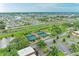 Scenic aerial view of tennis courts, surrounded by lush greenery and a vibrant cityscape at 1906 Canterbury Ln # 16, Sun City Center, FL 33573