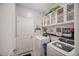 Well-organized laundry room with overhead cabinets, a washer, and a dryer for convenient chores at 2016 Bonito Way, Port Charlotte, FL 33953