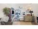 Spacious living room with large windows, sliding glass doors, comfortable seating, and view of the water at 2016 Bonito Way, Port Charlotte, FL 33953