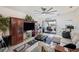Cozy living room featuring stylish furniture, neutral colors, a ceiling fan, and a sliding glass door at 2016 Bonito Way, Port Charlotte, FL 33953