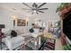 Bright open living area with comfortable seating, decorative lighting, and a view into the dining area at 2016 Bonito Way, Port Charlotte, FL 33953