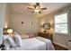 Bedroom with two beds, ceiling fan and shuttered windows at 2149 Muskogee Trl, Nokomis, FL 34275