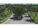 Beautiful Calusa Lakes entrance surrounded by palm trees, lush landscaping, and decorative signage at 2149 Muskogee Trl, Nokomis, FL 34275