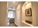 Hallway featuring art niche with shelf leading to primary bedroom at 2149 Muskogee Trl, Nokomis, FL 34275