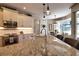 Modern kitchen featuring granite countertops, stainless steel appliances, and ample cabinet space at 2149 Muskogee Trl, Nokomis, FL 34275