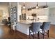 Stylish kitchen with a large island, granite countertops, and white cabinetry with stainless appliances at 2149 Muskogee Trl, Nokomis, FL 34275