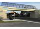 Legacy Trail shown with a bridge over the road and a covered rest stop for trail users at 2149 Muskogee Trl, Nokomis, FL 34275