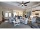 Open concept living space with living room, dining area, and kitchen with an eat-in island at 2149 Muskogee Trl, Nokomis, FL 34275