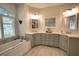 Bathroom featuring double sinks, bathtub, tile floors and white quartz counters at 2149 Muskogee Trl, Nokomis, FL 34275