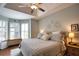 Main bedroom showcases tray ceiling, bay window, and neutral decor at 2149 Muskogee Trl, Nokomis, FL 34275