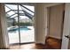 View of a screened pool and outdoor area as seen from inside the home at 2149 Muskogee Trl, Nokomis, FL 34275