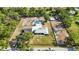 Expansive property featuring a pool, outbuildings, and a well-maintained home with lush landscaping, offering privacy and space at 2255 61St St, Sarasota, FL 34243