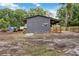 Outbuilding/Barn with a covered porch and adjacent outdoor area for equipment storage and other outdoor recreational activities at 2255 61St St, Sarasota, FL 34243