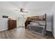 This bedroom features a bunk bed, a ceiling fan, wood-look floors, and a dresser at 2255 61St St, Sarasota, FL 34243