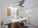 Brightly lit home office features a modern desk, a white chair, and gold decorative touches for a professional workspace at 2255 61St St, Sarasota, FL 34243