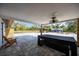 Covered patio with view of the pool, tiki bar, fire pit and lots of room at 2255 61St St, Sarasota, FL 34243