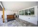 Covered patio with an outdoor bar and stone pavers at 2255 61St St, Sarasota, FL 34243