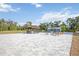 Expansive backyard patio featuring outdoor seating, tiki bar, and an inground swimming pool at 2255 61St St, Sarasota, FL 34243