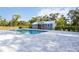 A lovely pool near a small, charming outdoor building with a silver roof at 2255 61St St, Sarasota, FL 34243