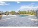 Pool featuring a pool house, tiki bar, fire pit, rocking chairs, and lots of area around the pool at 2255 61St St, Sarasota, FL 34243