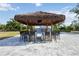Tiki bar area with seating and views of the pool and surrounding areas at 2255 61St St, Sarasota, FL 34243