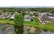 Aerial view showcasing a well-maintained backyard with pond access at 2334 50Th Street E Cir, Palmetto, FL 34221