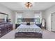 Serene main bedroom features a decorative headboard and nightstands with backyard views at 2334 50Th Street E Cir, Palmetto, FL 34221
