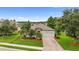 Beautiful single-story home featuring a two-car garage, stone accents, and lush landscaping at 2334 50Th Street E Cir, Palmetto, FL 34221