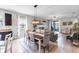 Sunlit living room and dining area features stylish decor, wood floors, and plenty of seating at 2334 50Th Street E Cir, Palmetto, FL 34221