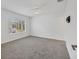 Bright bedroom with a ceiling fan, a large window, and neutral carpeting at 262 Cape Harbour Loop # 101, Bradenton, FL 34212