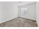 Image of carpeted bedroom with ceiling fan and a window at 262 Cape Harbour Loop # 101, Bradenton, FL 34212