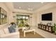 Cozy living room featuring a sliding glass door leading to an outdoor patio at 26687 Raphis Royale Blvd, Englewood, FL 34223