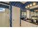Stylishly designed main bathroom featuring black countertop and shower with glass enclosure at 26687 Raphis Royale Blvd, Englewood, FL 34223